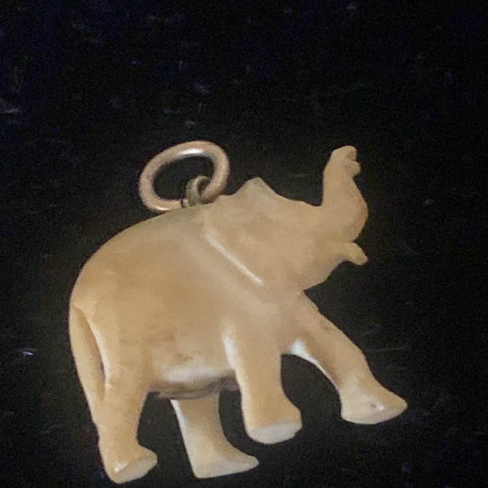 Vintage Ivory like Carved Resin Baby Elephant .  Baby Elephant size is approx 1”